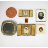 A collection of miscellaneous items, a.o. 4 frames, a Dupont lighter, a terracotta plaque and a fift