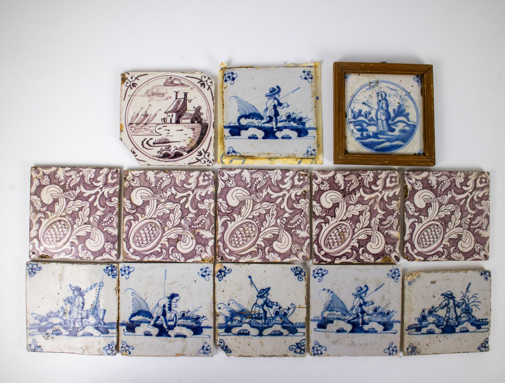 A collection of 13 Delft tiles