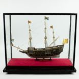 Display case with a model boat of the Royal Sovereign 1637