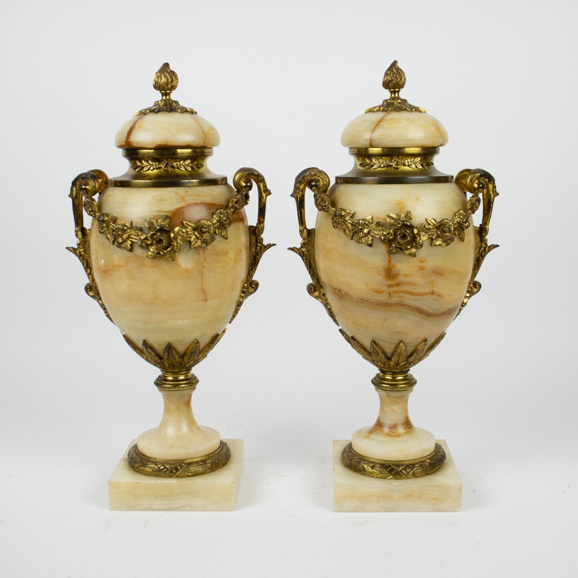 A pair of casolettes in marble with gilt bronze mounts