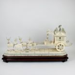 A large Chinese ivory group with a carriage pulled by a deer