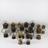 A collection of 13 old oil lamps