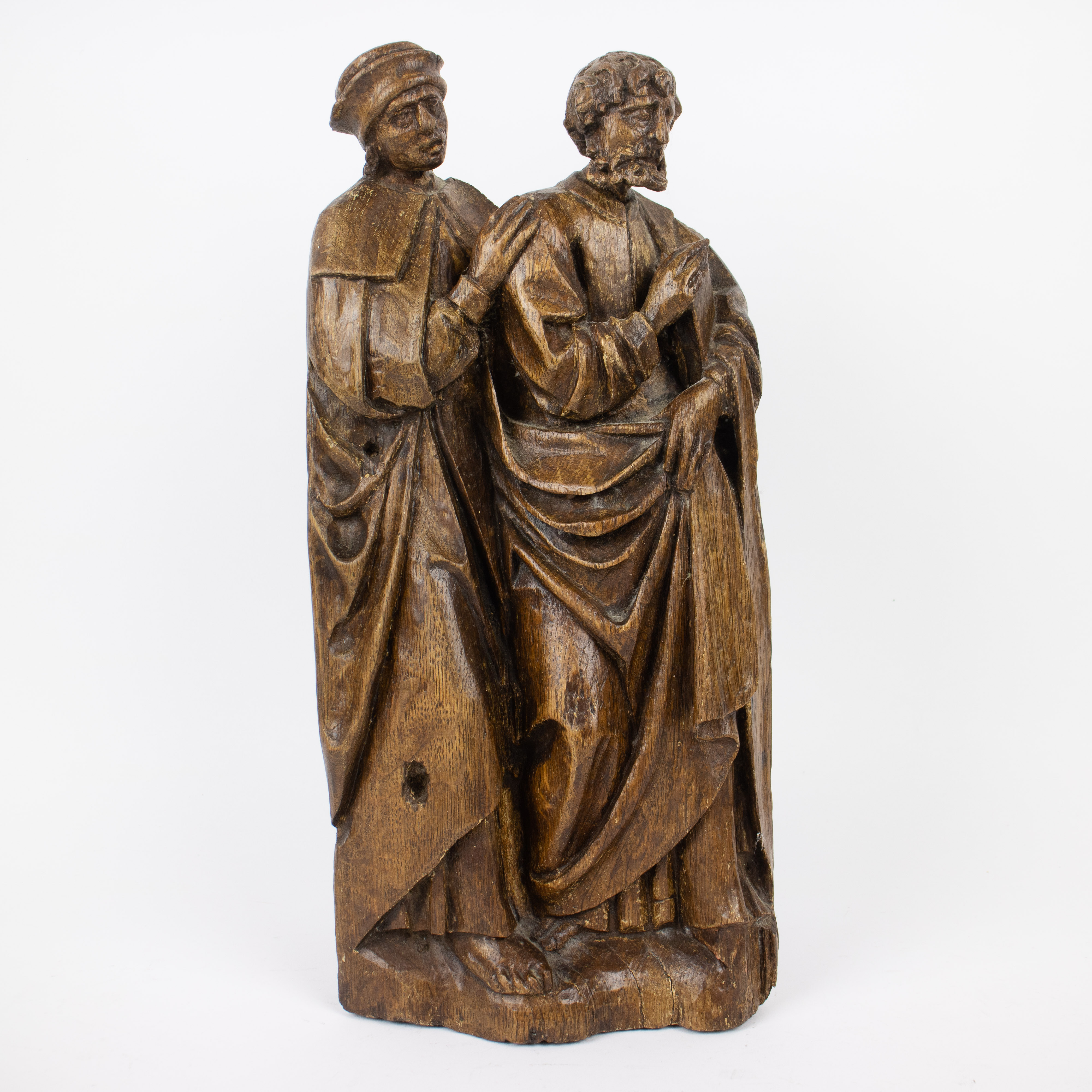 A carved wooden relief of two Saints, Flemish late 15th early 16th century