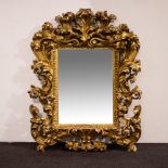 Ornate mirror in baroque style with acanthus leaf decoration in gilt plaster, France