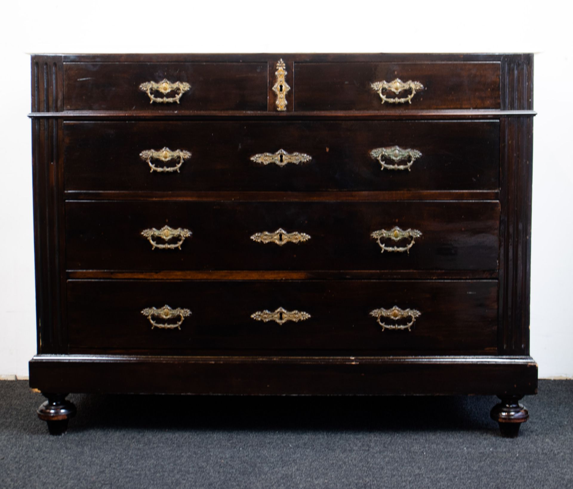 English chest of drawers with white marble top