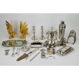 A large collection of silver plated items, including a foi gras dish, a wine bottle holder and more