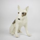 A glazed porcelain sculpture of a dog English.