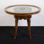 An Art Deco lounge table with milk glass