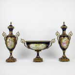 Sèvres handpainted garniture centre piece and a pair of covered vases