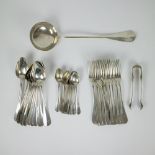 A collection of silver cutlery and a ladle