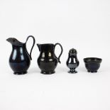 A collection of black glazed jugs, butter pot and salt cellar in Namur earthenware, 18th century