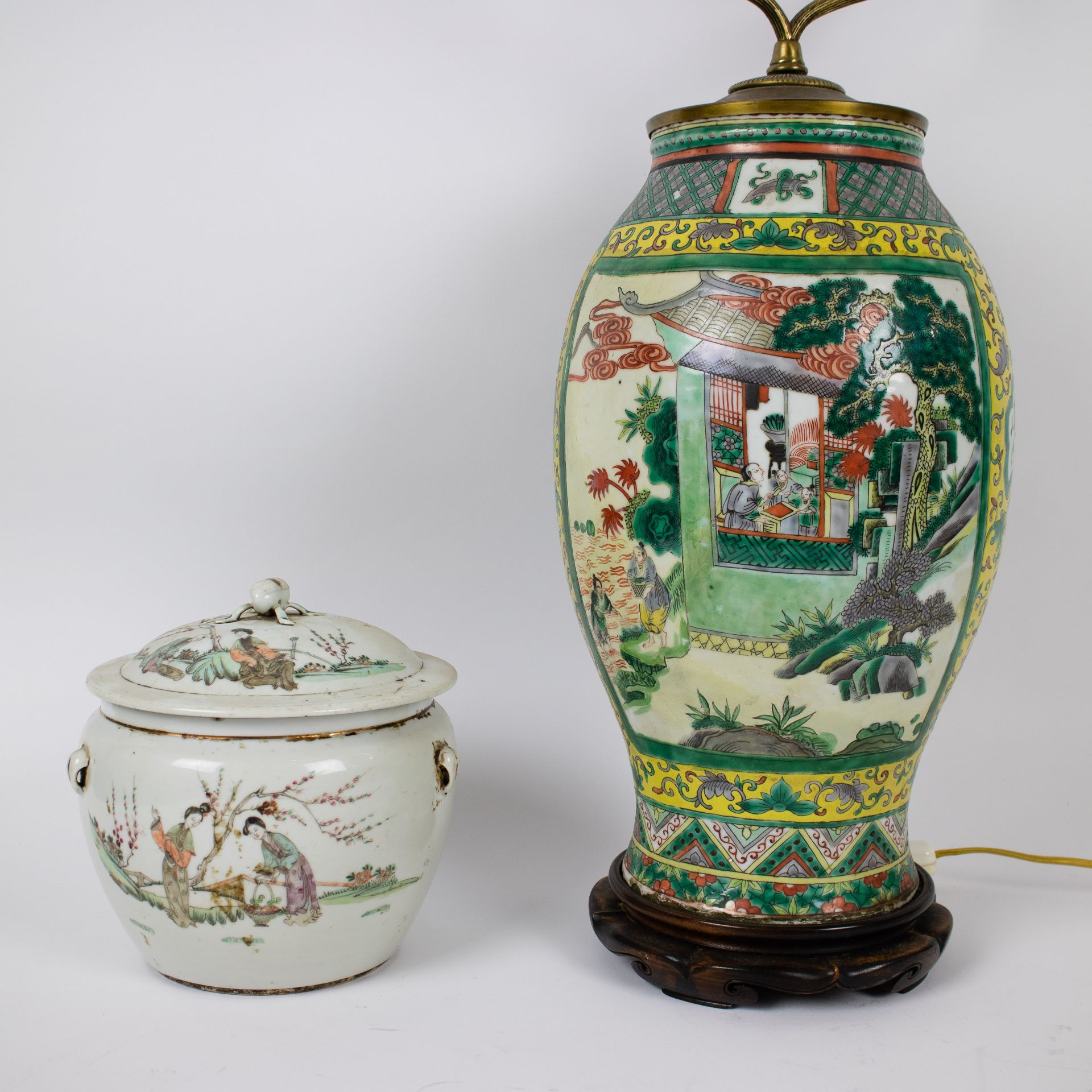 A Chinese storage jar and a famille verte vase
