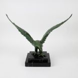 A bronze sculpture of an eagle