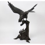 A large bronze scupture of an eagle on a tree stump, Japan, Meji period