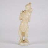 Marine ivory sculpture of a woman carrying a child on her back, Greenland, early 20th century.