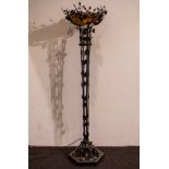 Large Art Deco floor lamp in wrought iron and coupe in glass paste, signed.