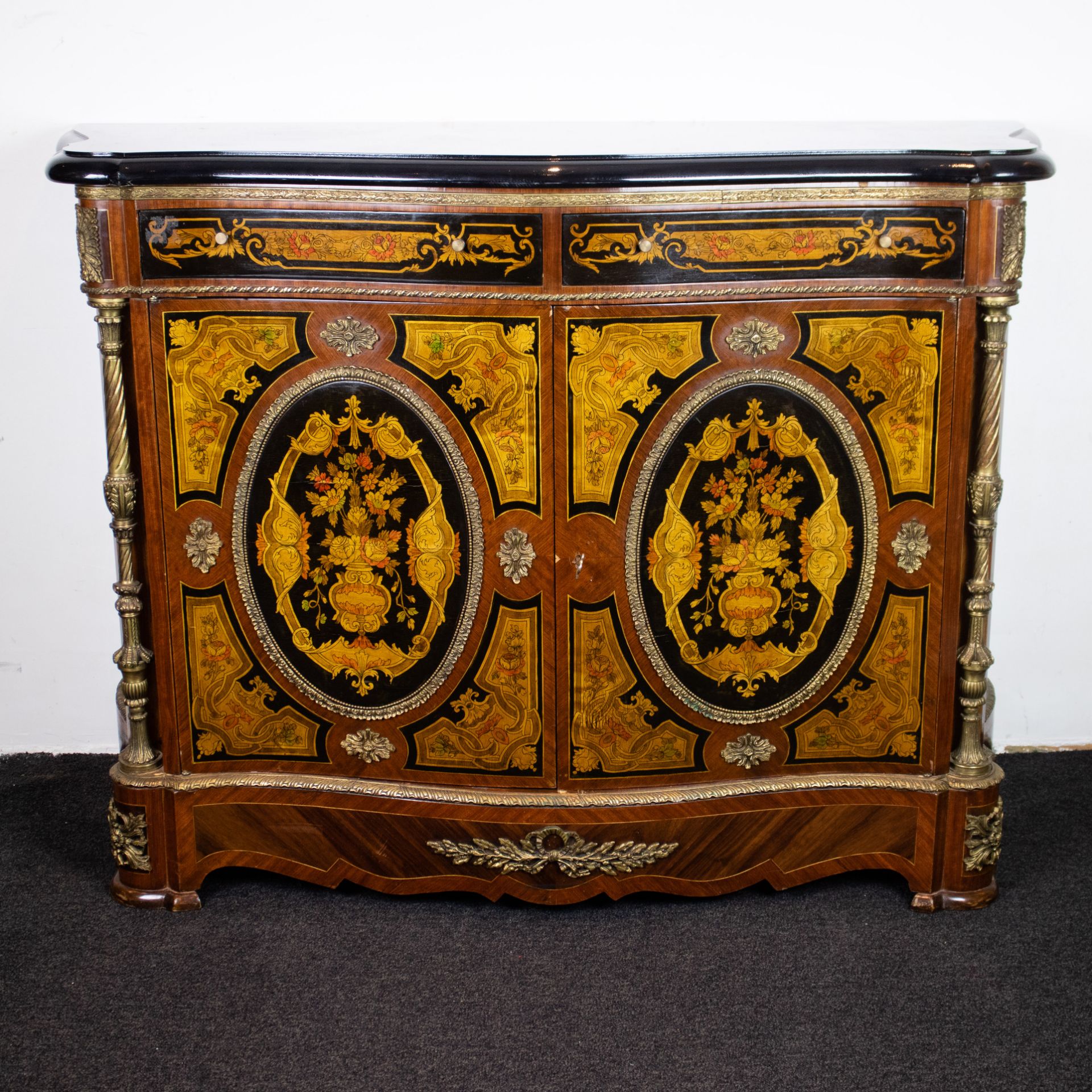 Cabinet with bronze mounts and a wooden top