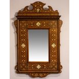 Wooden mirror with bone marquetry and four medaillons