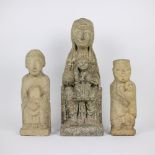 3 figures carved in white stone