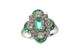 AN EMERALD AND DIAMOND RING