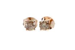 A PAIR OF DIAMOND STUD EARRINGS