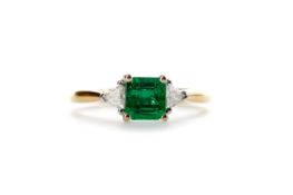 AN EMERALD AND DIAMOND RING