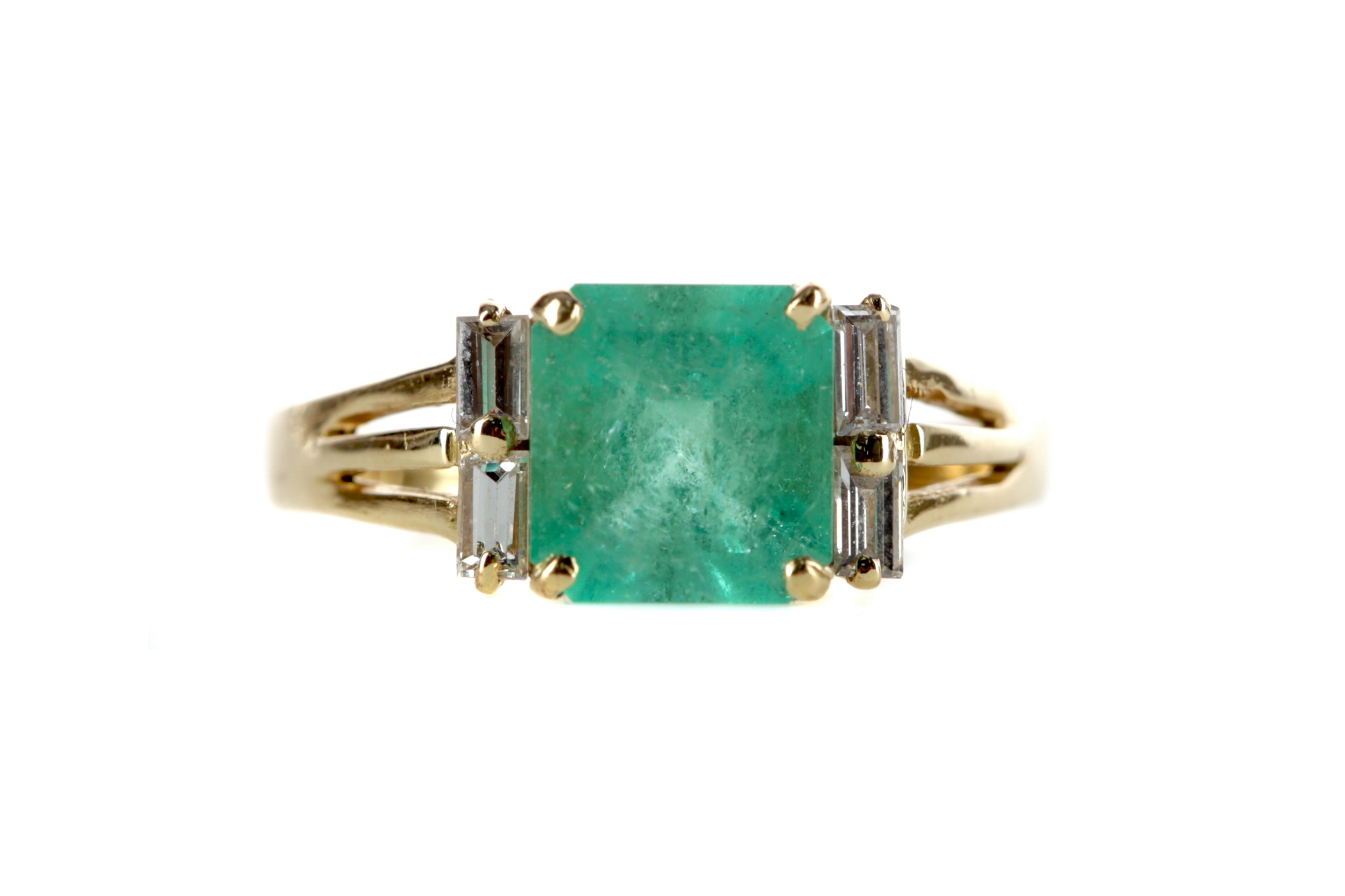 AN EMERALD AND DIAMOND RING