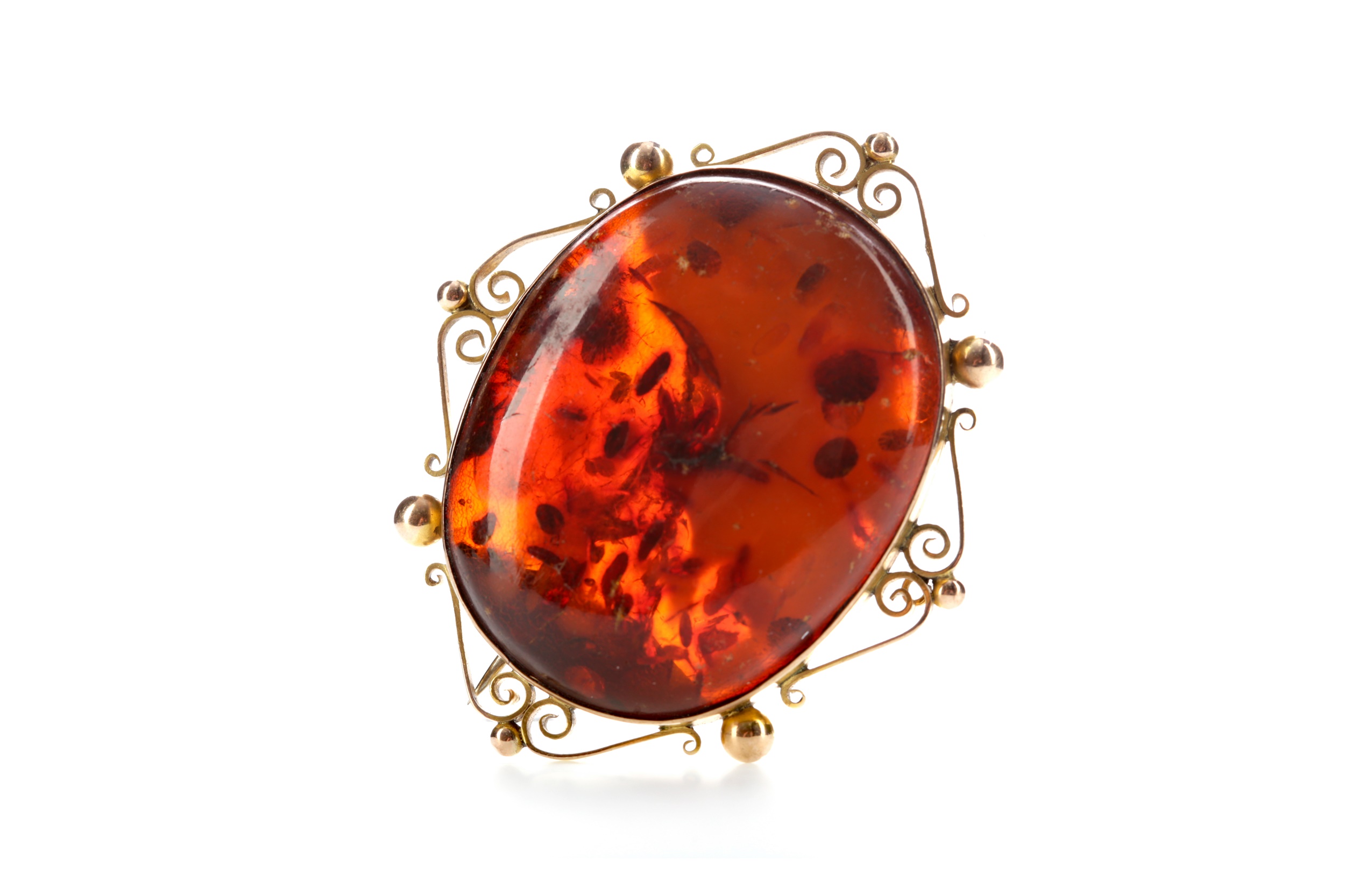 A BALTIC AMBER BROOCH