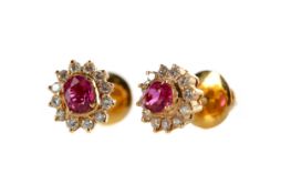 A PAIR OF RUBY AND DIAMOND CLUSTER EARRINGS