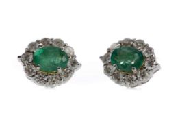 A PAIR OF EMERALD AND DIAMOND EARRINGS