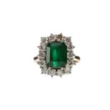 AN EMERALD AND DIAMOND RING