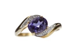 AN IOLITE AND DIAMOND RING