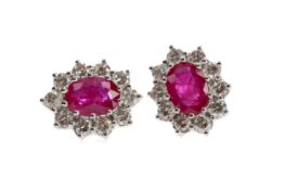 A PAIR OF RUBY AND DIAMOND CLUSTER EARRINGS