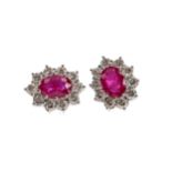 A PAIR OF RUBY AND DIAMOND CLUSTER EARRINGS