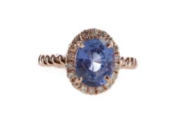 A SAPPHIRE AND DIAMOND RING