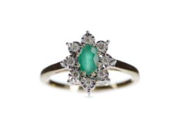 AN EMERALD AND DIAMOND RING