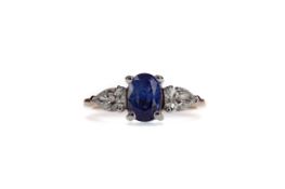 A SAPPHIRE AND DIAMOND THREE STONE RING