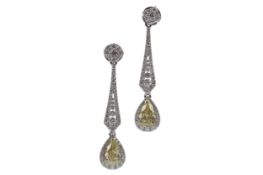 A PAIR OF CERTIFICATED YELLOW DIAMOND EARRINGS