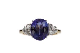 A TANZANITE AND DIAMOND RING