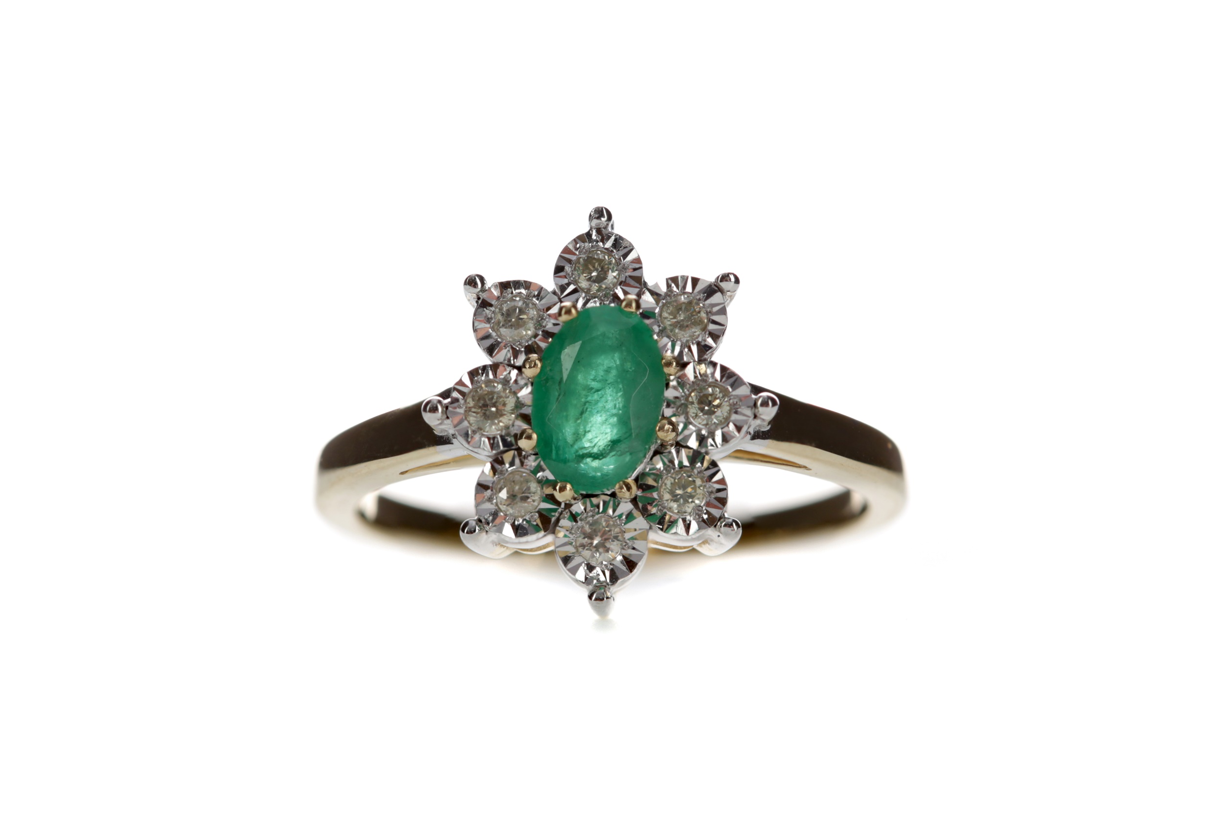 AN EMERALD AND DIAMOND CLUSTER RING