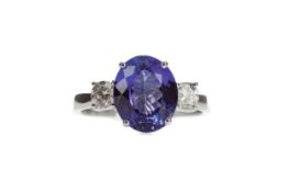 A TANZANITE AND DIAMOND RING