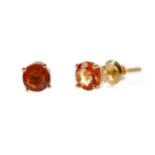 A PAIR OF TREATED ORANGE SAPPHIRE STUD EARRINGS