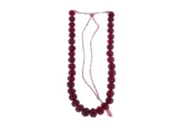 A CARVED RUBY NECKLACE