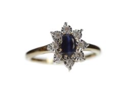 A SAPPHIRE AND DIAMOND CLUSTER RING