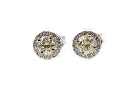 A PAIR OF CERTIFICATED YELLOW DIAMOND STUD EARRINGS