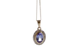 A TANZANITE AND DIAMOND PENDANT