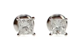 A PAIR OF DIAMOND STUD EARRINGS