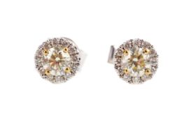 A PAIR OF DIAMOND CLUSTER EARRINGS