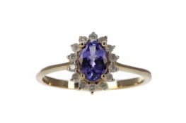 A TANZANITE AND DIAMOND RING