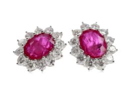 A PAIR OF RUBY AND DIAMOND CLUSTER EARRINGS